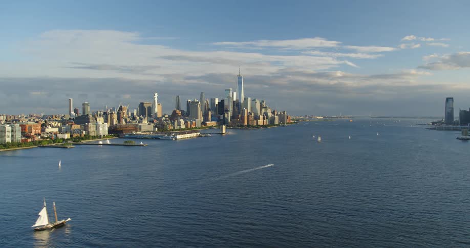Flying over a river along a metropolis area