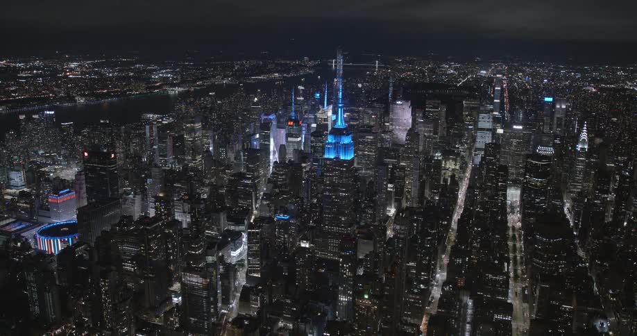 Aerial view of the tall skyscrapers on new york city downtown at night