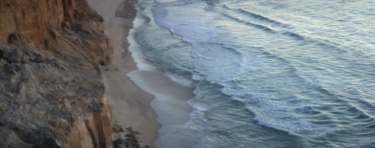 Aerial view of waves rolling in to the shore
