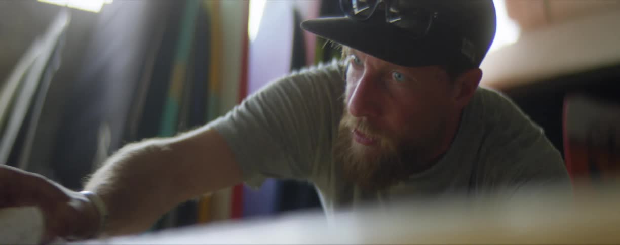 A man works on an item indoors