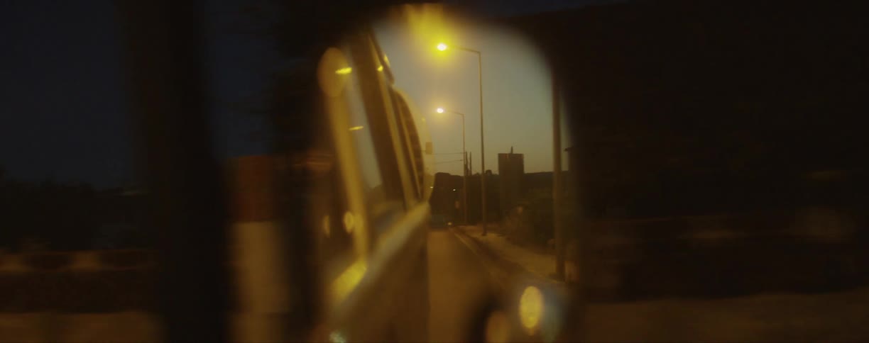 A vehicle driving down a street
