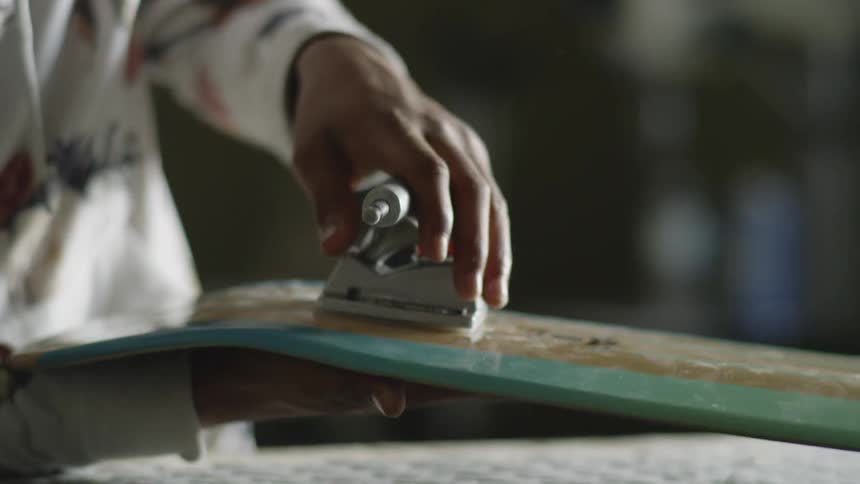 A man assembles a skateboard
