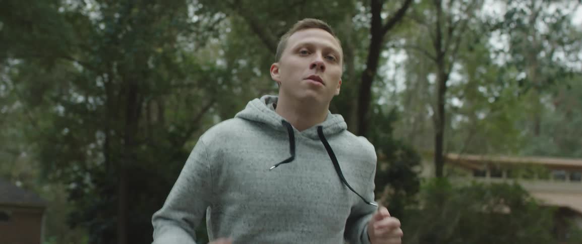 A man running in a neighborhood