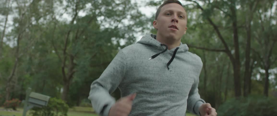 A man running down a trail