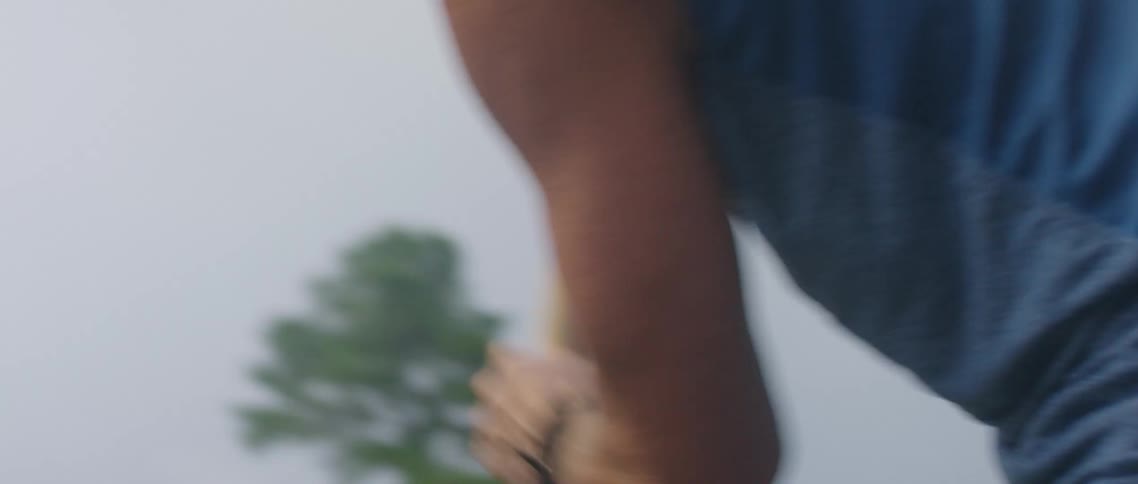 A man digging a hole with a shovel outside
