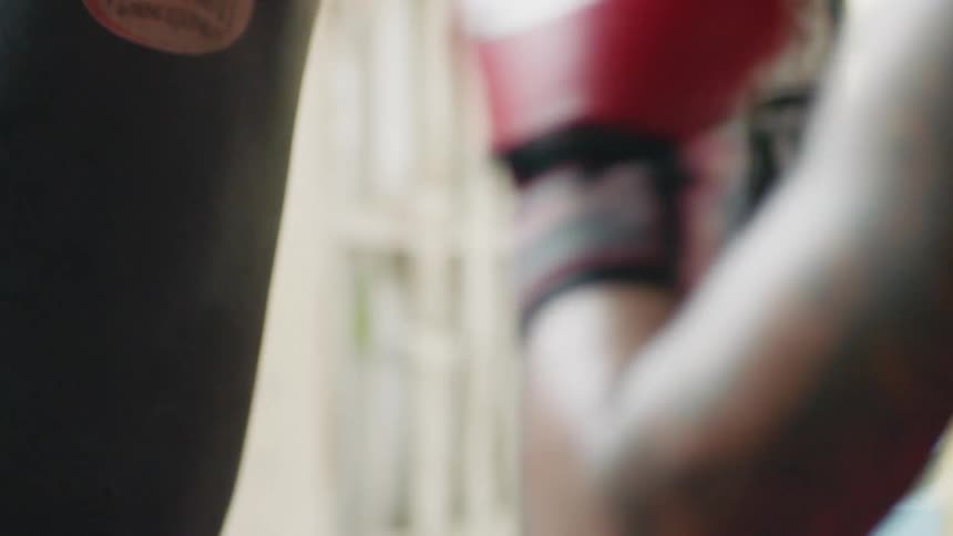 A man practicing with a punching bag
