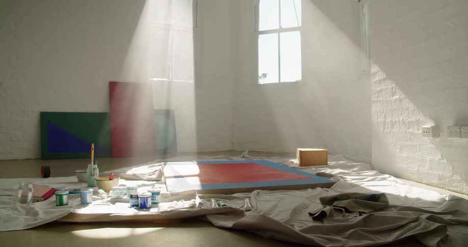 A painting and art supplies sitting in a room