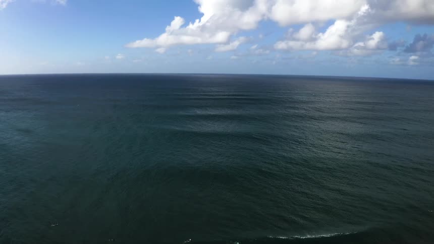 An aerial view of ripples moving in the ocean
