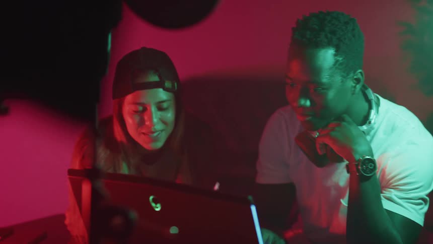 Two people sitting at a computer