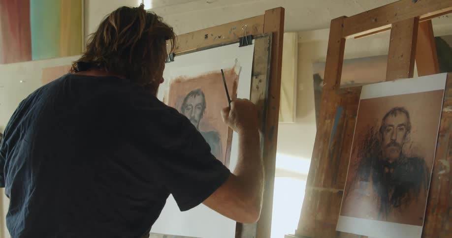 An man painting a portrait