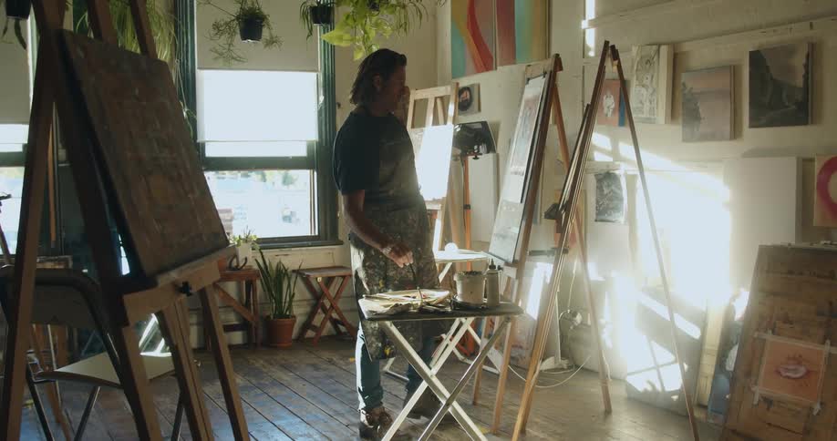 A man working on a painting