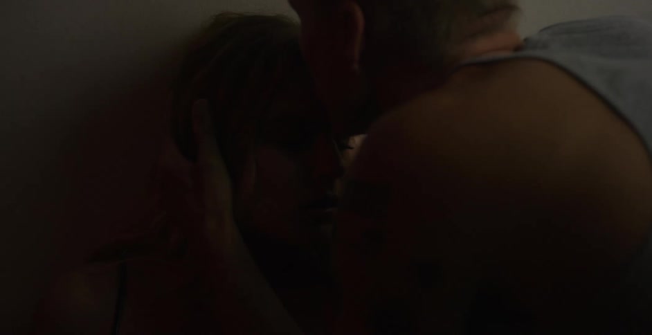 A man kissing a womans head
