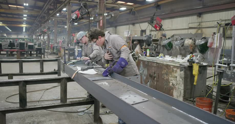 A group of workers working on an assembly line