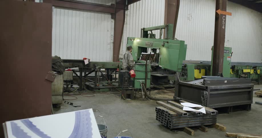 A worker using a lathe