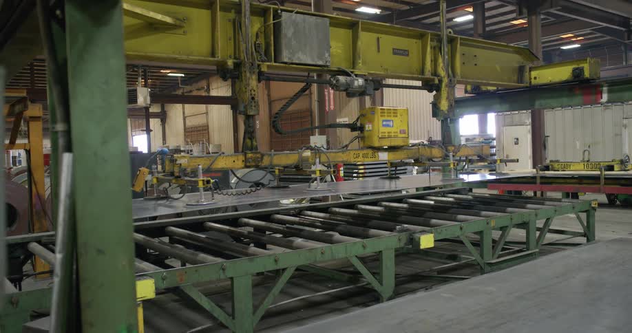 A machine moving metal to a platform