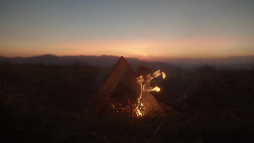 A campfire during sunset