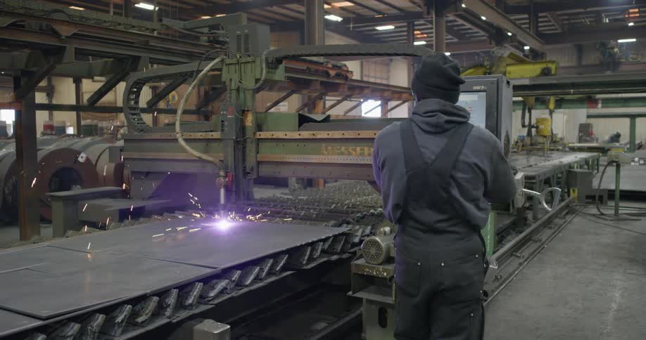 A worker using a cutter