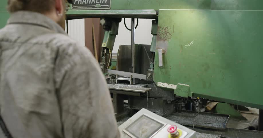 A man working on a metal mill