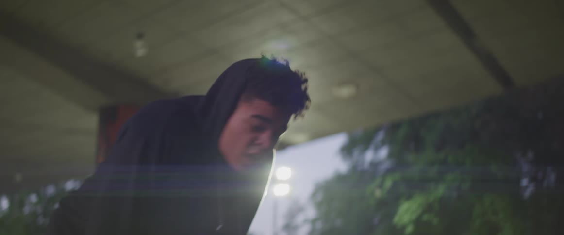 Black teenager boy wearing a hoodie preparing and starting to run