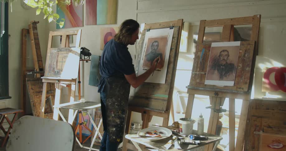 A man working on a painting