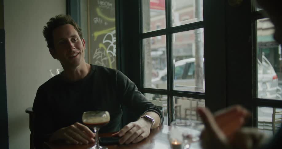 Two men in a pub talking together