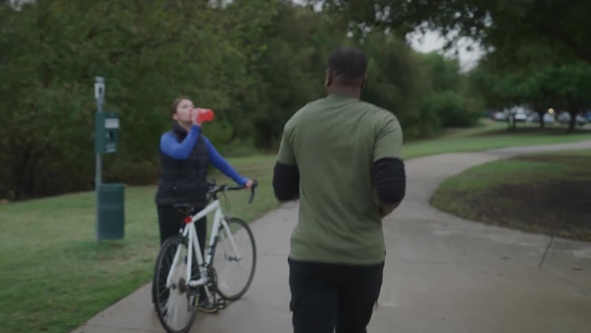Black man jogging in a park