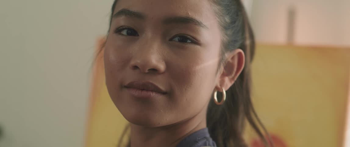 Close up of a smiling young womans face in a room