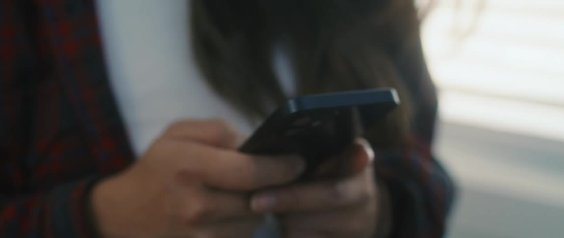 Teenager girl using her smartphone