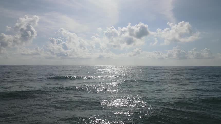 Sunlight reflecting over the small waves on the surface of the ocean