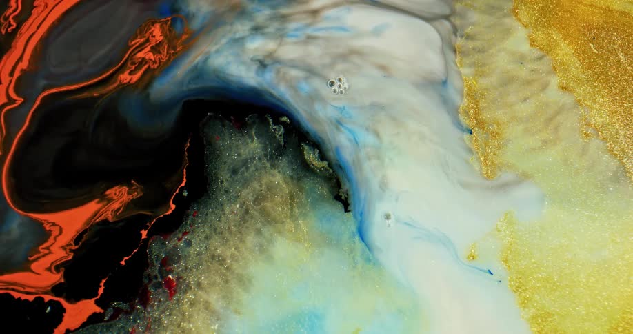 A microscopic view of yellow black white blue and orange liquids flowing to the left