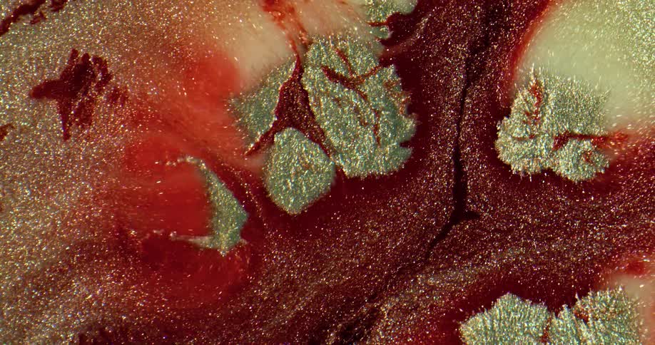 The red and gold glitter mix around