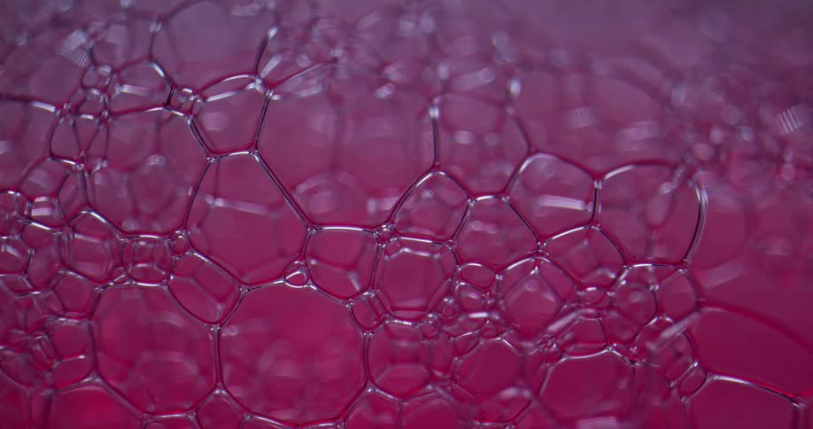A close up of bubbles in a glass