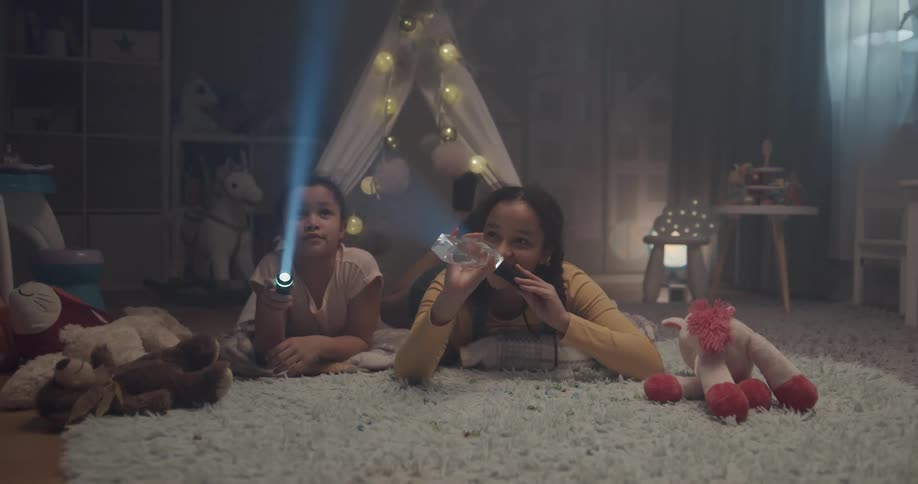 Two teenagers playing with a crystal