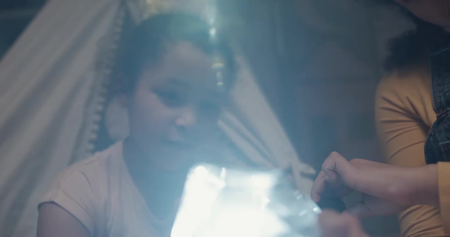Two teenagers playing with a crystal
