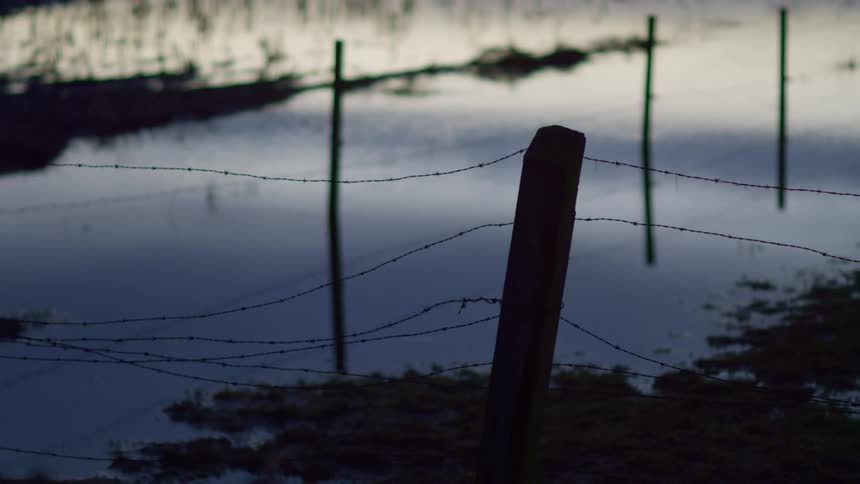 Water is flowing in a fenced in area