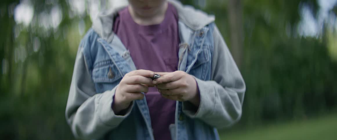 A person holding a rock