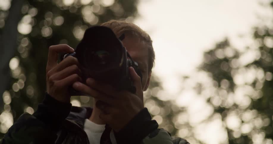 A man taking a photo with a camera