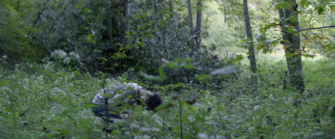 A man raging in a forest