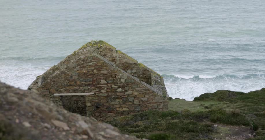 The waves crash against the shore