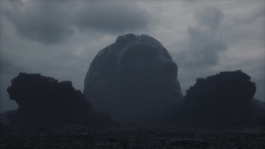 Eroded giant head sculpture on the deserted rocky plains under gray clouds