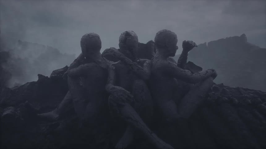 Three men sitting on a rock