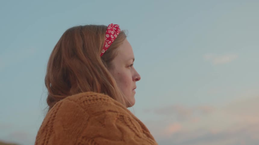 A woman looking into the sunset