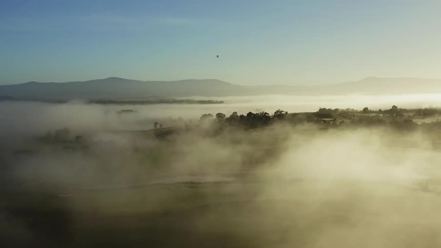 Heavy fog rolls over the fields
