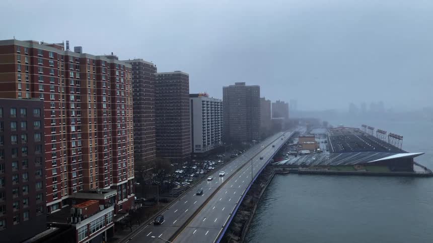 City highways between sea and buildings on a cloudy day
