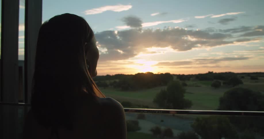 A woman looking out into the sunset