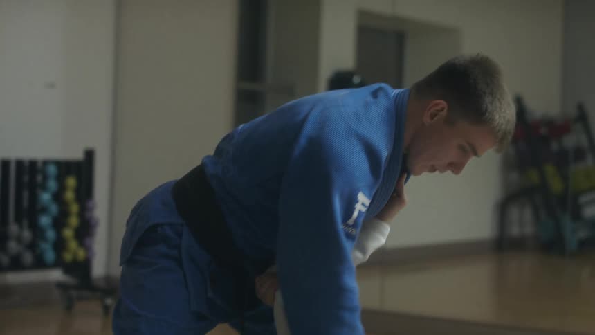 Two men fighting in robes