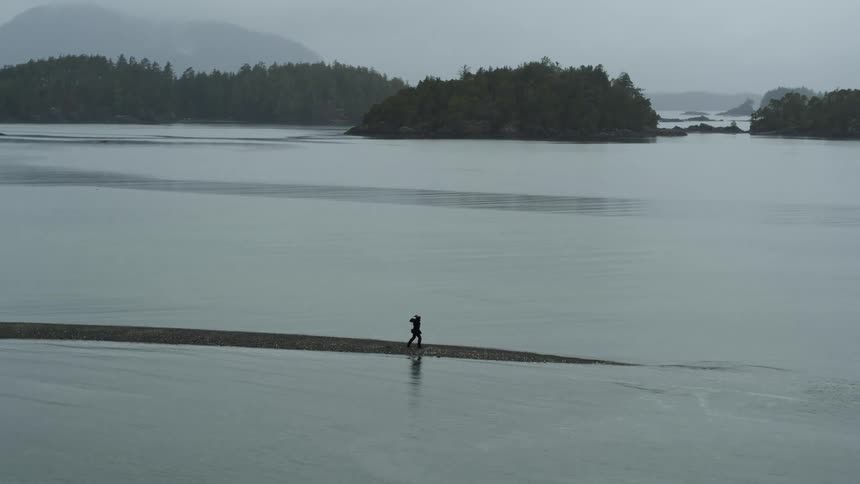 A person is walking across a lake during the day