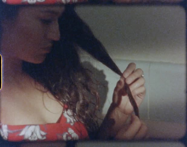 A woman with a dress sitting in a bathtub with water