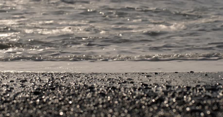 Waves gently crash on a beach