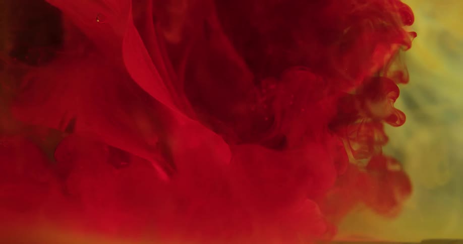 Red dye shoots into liquid then expands floats and rises